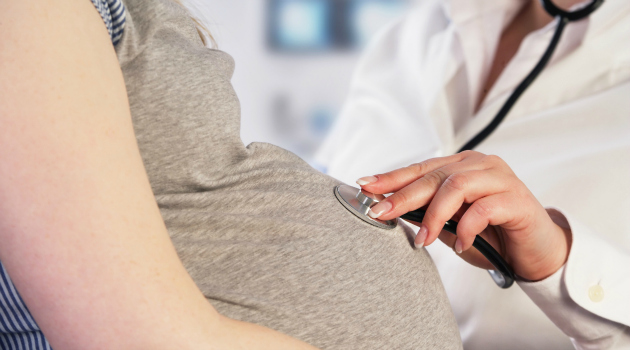 Doctor examining a pregnant woman