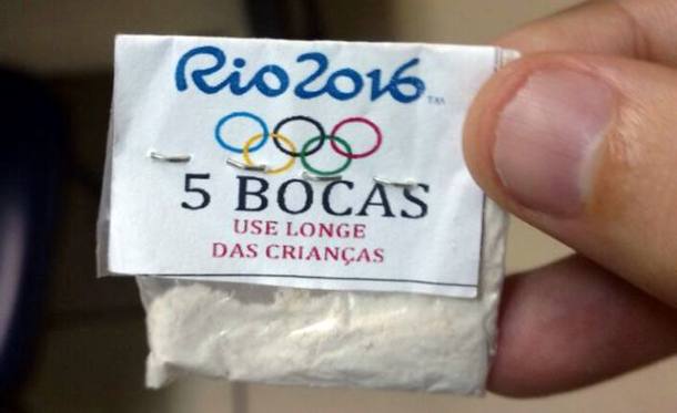 One of dozens of packages of cocaine stamped with a Rio 2016 label, the Olympic rings, and a warning that reads, "Keep away from children,"  confiscated by police in a raid on the Lapa neighborhood of Rio de Janeiro, Brazil on July 25, 2016. Picture taken July 25, 2016.  REUTERS/Rio de Janeiro State Police/Handout via REUTERS/      ATTENTION EDITORS - THIS IMAGE WAS PROVIDED BY A THIRD PARTY.  THIS PICTURE WAS PROCESSED BY REUTERS TO ENHANCE QUALITY. AN UNPROCESSED VERSION HAS BEEN PROVIDED SEPARATELY. EDITORIAL USE ONLY