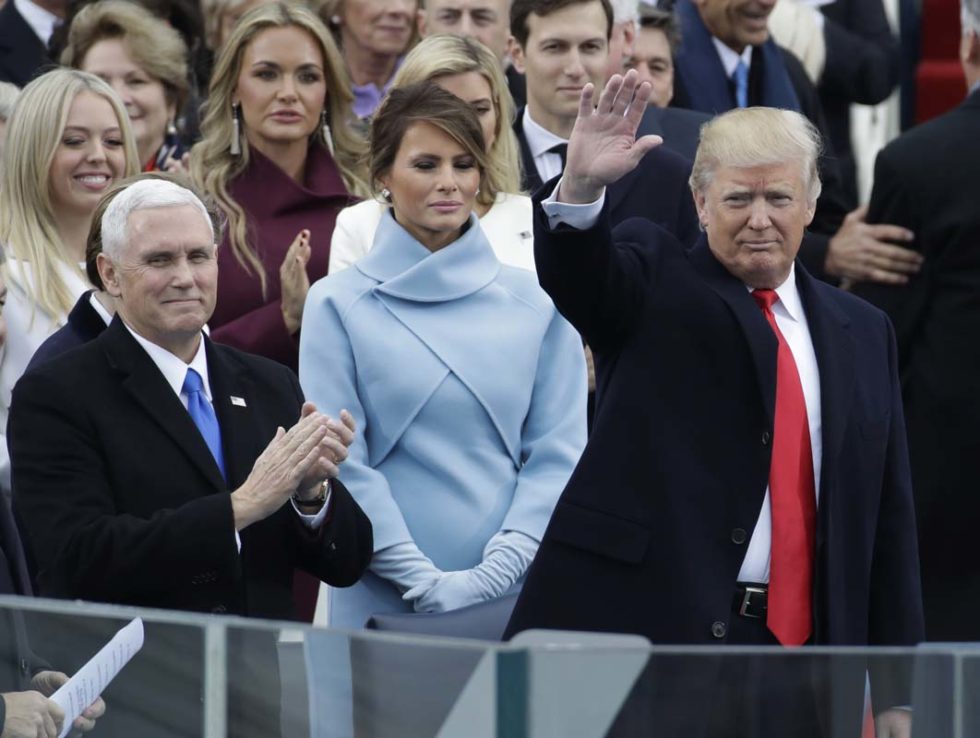 President-elect Donald Trump waves with Vice President-elect Mike Pence and his wife Melania Trump before the 58th Presidential Inauguration at the U.S. Capitol in Washington, Friday, Jan. 20, 2017. (AP Photo/Patrick Semansky)