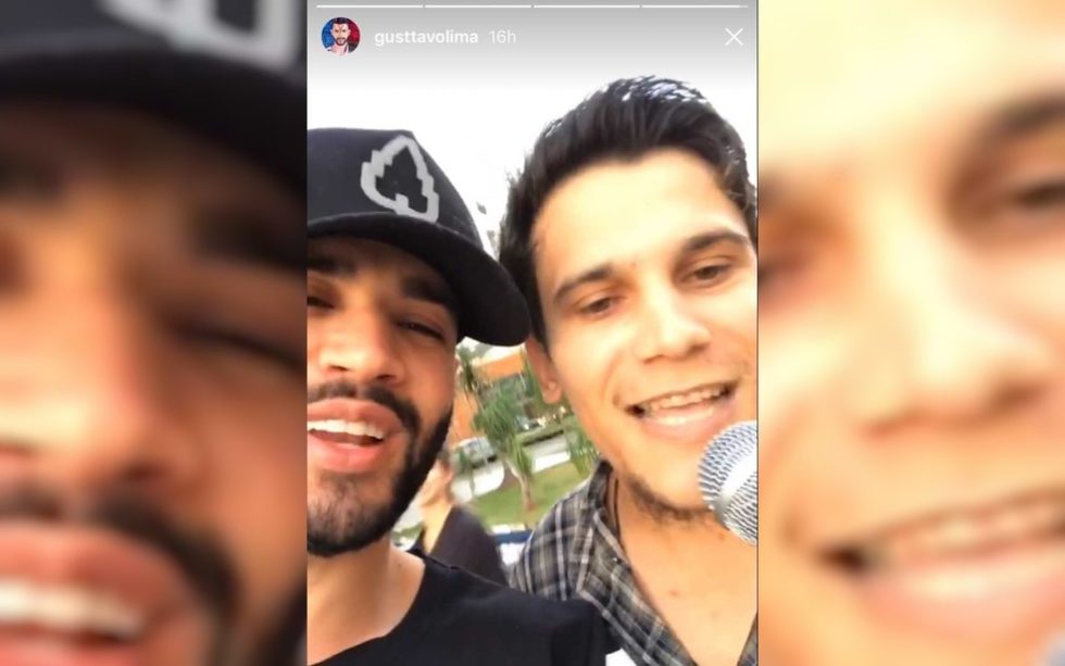 Gusttavo Lima chama artista de rua para cantar com ele